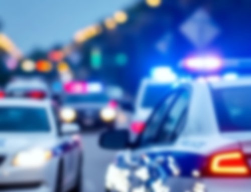 Police cars with flashing lights at a scene