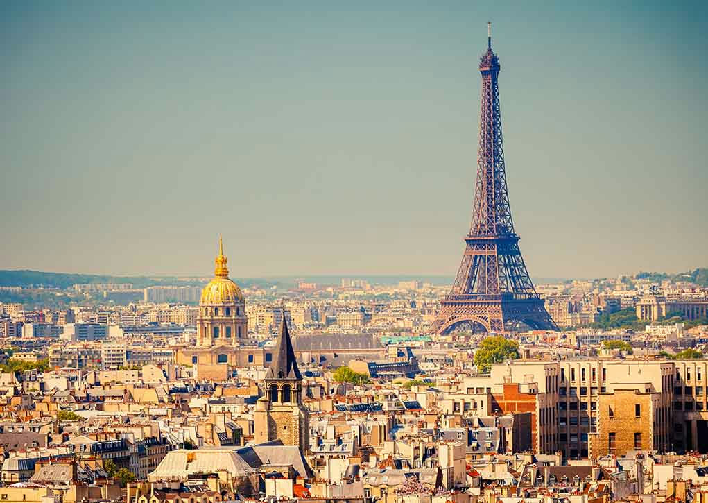 Eiffel Tower and Paris skyline in daylight.