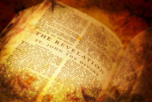 Open book displaying the text of Revelation from the Bible