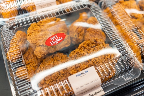 Packaged fried chicken in a grocery store with EBT eligibility label