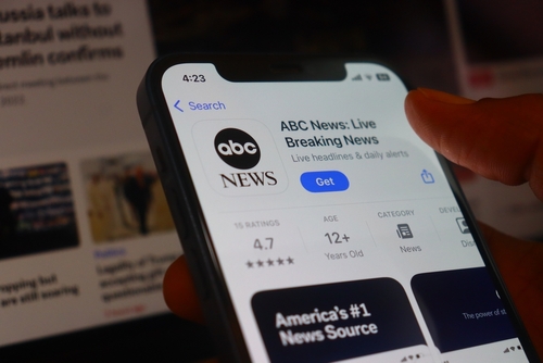 Close-up of a smartphone displaying the ABC News app